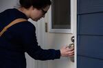 Sarah Collins keys into her Airbnb in Portland, Ore., after her shift Tuesday, April 7, 2020. Collins, an intensive care unit nurse at PeaceHealth Southwest, chose to live in an Airbnb during the COVID-19 pandemic to isolate from her family.