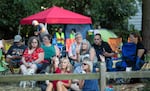Residents listen to a band performing at the annual National Night Out event in Maywood Park, Ore., on Saturday, July 27, 2019.