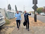 FILE: Then-Portland City Council candidate Rene Gonzalez walks in Portland's Woodlawn neighborhood with campaign manager Shah Smith in October 2022.