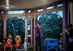 Artist and poet, Tazha Williams, performs spoken word on top of a musical bed of stringed instruments playing at the violin vigil for Elijah McClain at Peninsula Park in Portland, Ore., Friday, July 3, 2020. 