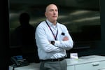 This photo shows Dave Doherty, president of DigiKey, at the company’s headquarters. Photographed from about the waist up, he's wearing gray slacks and a long-sleeved, white button-down shirt with a light blue grid pattern on it.