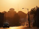 The sun rises over the city of Springfield, Ohio, Monday, Sept. 16, 2024. (AP Photo/Jessie Wardarski)