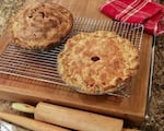 Edges crimped, vents cuts and egg wash applied, "Art of the Pie" author Kate McDermott's apple-pear (top left) and cranberry (bottom right) pies come out of the oven golden brown.