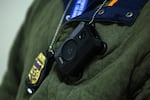 A federal agent wears a body camera as they patrol the halls of immigration court at the Jacob K. Javits Federal Building on March 04, 2026 in New York City.