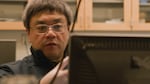 In this video still taken in March, WSU Vancouver professor Feng Zhao tests honey-based computer components called memristors that were developed in his lab.