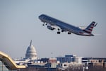 An American Airlines jet takes off from Ronald Reagan Washington National Airport on January 29, 2026. The U.S. Capitol dome is in the background.
