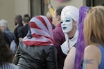 People embrace prior to a vigil for victims of the attack on a gay nightclub in Orlando in Portland's Mississippi neighborhood on Friday, June 16, 2016.