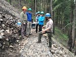 FILE - In the aftermath of the Eagle Creek fire, crews had to replace many miles of trails in the Columbia River Gorge. This work party was restoring infrastructure in the gorge in June 2018.