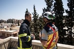 Firefighter Naser Brjas and white helmet Kinan Ali respond to an emergency call in Damascus on March 31, 2025.