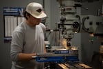 In a photo provided by Central Oregon Community College, Victor Hedeen uses a vertical milling machine to remove material on a project during a manufacturing processes class in the manufacturing technology lab in Redmond, Ore., in November 2024.