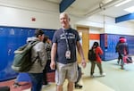 Paraeducator David Waldrip in the hallways as students change classes at Cedar Park Middle School, Feb. 22, 2023. 