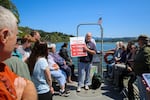 Duncan Berry, co-director of the Cascade Head Biosphere Collaborative, explains different salmon species to attendees while on a boat tour of the Salmon River estuary during the 50th anniversary celebration of the Cascade Head Biosphere Region at Knight Park outside of Otis, Ore., on July 18, 2026. 