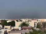 Smoke rises from behind residential areas after explosions in Doha, Qatar, on Tuesday. Israel said it launched a strike targeting senior Hamas leaders.