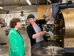Emily Smith of Hacea Coffee Source shows U.S. Rep. Suzanne Bonamici, D-Beaverton, coffee roasting equipment Thursday afternoon at Southeast Portland’s Buckman Coffee Factory. Bonamici met with members of the coffee industry to hear about damage from tariffs on May 29, 2025.