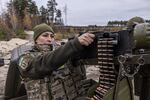 Tetiana loads the Maxim machine gun during the training in Kyiv region, Ukraine on Nov. 9, 2024.