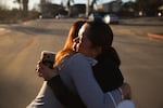 Pasadena Park Healthcare & Wellness Center COO Amy Johnson, left, hugs Rhea Bartolome, vice president of operations, outside their center after the Eaton Fire, Sunday, Jan. 12, 2025, in Pasadena, Calif. They returned to check on the facility after evacuating senior care residents from the fire.