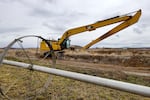 Heavy machinery mingles with irrigation equipment on the edge Knife River's Woodward pit in Crook County, Oregon. April 12, 2023