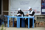 United Nations High Commissioner for Refugees workers prepare to distribute non-food items to women at UNHCR office in Kandahar on March 8, 2022. The Taliban has demanded that Afghan women no longer work for the UN or NGOs.