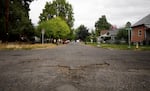 A pothole-filled road in La Grande, Ore., on Sept. 30, 2026. The city is proposing a local 5-cent-per-gallon gas tax to help repair and maintain deteriorating roads.