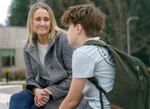 Jennifer Brooks talks with her son, Hudson, as she picks him up from school in Lake Oswego, Jan. 26, 2023. Hudson, who has learning disabilities that can make reading and writing difficult, fell behind his peers at school during the pandemic. 