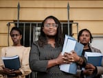 Kenyan lawyer Mercy Mutemi (center) speaks to the media in Nairobi on Dec. 14 after filing a lawsuit against Meta accusing Facebook's parent company of fanning violence and hate speech.
