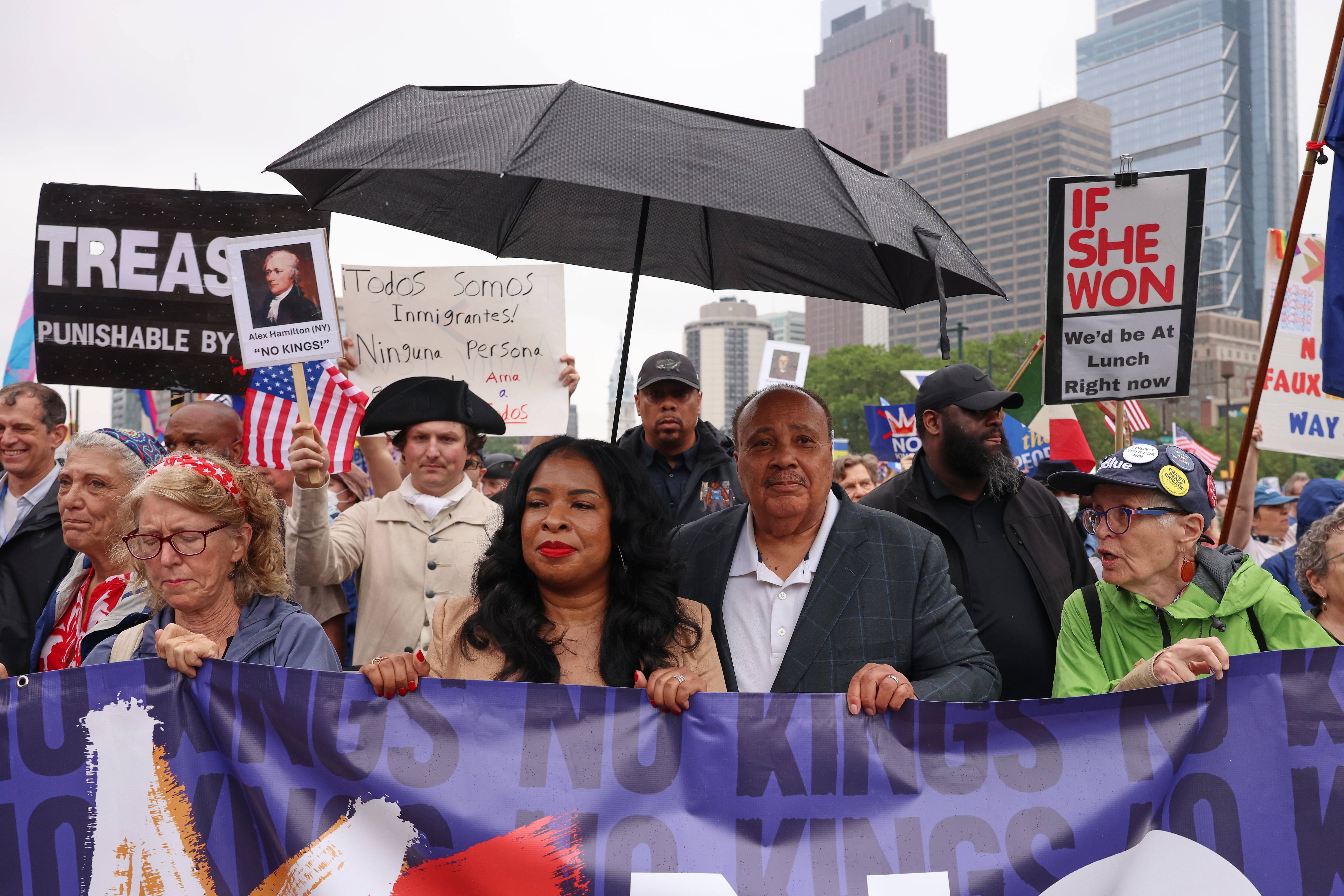 Philadelphia: Martin Luther King III, center right, and his wife Arndrea Waters King, center left, march.