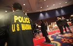 A U.S. Marshal looks on an auction in 2009 in New York City.