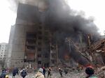 Firefighters work to extinguish a fire at a damaged city center after a Russian air raid in Chernigiv, Ukraine, Thursday, March 3, 2022. Russian forces have escalated their attacks on crowded cities in what Ukraine's leader called a blatant campaign of terror.