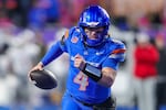 FILE - Boise State quarterback Maddux Madsen (4) scrambles with the ball on a touchdown run against UNLV in the first half of the Mountain West championship NCAA college football game, Dec. 5, 2025, in Boise, Idaho.