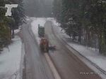 Snow plows clear U.S. Route 26 near the junction with Oregon Route 216 on Tuesday, March 12, 2024 in the Oregon Cascades where heavy snowfall is forecasted until the evening.