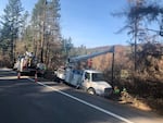 Utility crews replace power poles burned in the Beachie Creek Fire east of Salem in September 2020.