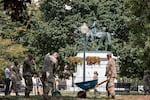 National Guard troops clear leaves and debris from McPherson Square Park in D.C. in August.