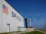 A SpaceX Falcon 9 rocket with the Crew Dragon spacecraft sits on Launch Complex 39A after its launch was scrubbed at the Kennedy Space Center on Friday, Aug. 25, 2023 in Cape Canaveral, Fla.
