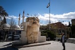 The11-foot-high stone Lion of al-Lat, damaged outside the Palmyra museum by ISIS, was pieced together and is now on display in the Damascus museum’s garden, amid orange trees filled with songbirds on Feb. 20, 2025.