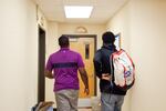 Dwight Roberson, left, walks with Emorej, a senior, at South Salem High School in Salem, Ore., Tuesday, Sept. 17, 2019. Community resource specialists like Roberson help student groups achieve academic success with one-on-one support.