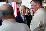 President Biden shakes hands with union members after giving a speech about his economic agenda at a union hall in Accokeek, Md., on April 19.