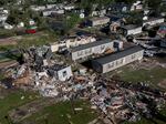 Storm damaged mobile homes are surrounded by debris at Pavilion Estates mobile home park just east of Kalamazoo, Mich., on  Wednesday, May 8, 2024.