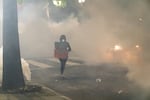 Portland's Friday night protests ended with police using tear gas, flash bangs and rubber bullets to disperse the crowd, after protesters threw water bottles and fruit at police and then knocked down a fence.