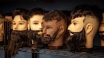 Practice mannequin heads at the Champions Barbering Institute on Friday, May 1, 2020, in Portland, Ore.