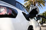 A Volkswagen ID.4 electric vehicle charges via a fast charger in Torrance, Calif., on February 23, 2024. A federal program to fund fast chargers across the U.S. has been on pause for six months, but the Trump administration is now restarting it.
