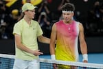 Jannik Sinner, left, of Italy is congratulated by Ben Shelton of the U.S., following their semifinal match at the Australian Open tennis championship in Melbourne, Australia, Friday, Jan. 24, 2025.