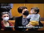 Rep. Karin Power on the House floor with her 18-month-old son on Monday
