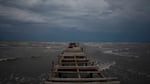 Waves kick up under a dark sky Monday along the shore of Batabano, Cuba. Hurricane Ian was growing stronger as it approached the western tip of Cuba.