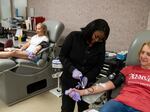 Tuyishimire Primitiva, phlebotomist with the American Red Cross, draws whole blood from Teresa McLeland at the American Red Cross on April 12, 2023 in Louisville, Kentucky.