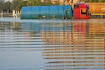 A tanker truck sits abandoned in floodwater in Dubai, United Arab Emirates, Thursday. The United Arab Emirates attempted to dry out Thursday from the heaviest rain the desert nation has ever recorded, a deluge that flooded out Dubai International Airport and disrupted flights through the world's busiest airfield for international travel.