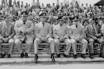 Salvadoran military commanders and the head of the Treasury Police Colonel Nicolás Carranza, 3rd left, sit during a military ceremony at the Escuela Militar Capitán General Gerardo Barrios in Santa Tecla, El Salvador, May 1983. (Photo by Robert Nickelsberg/Getty Images)