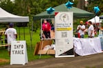 On Sept. 8, a large photo of the late Art McConville, Niimipuu and Cayuse, former organizer and leader of the water ceremony, was set up next to the Portland Harbor Community Coalition information table where attendees could ask questions, gather environmental justice and informational pamphlets, t-shirts and more.