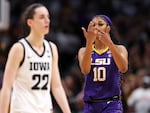 Angel Reese of the LSU Tigers gestures towards Caitlin Clark of the Iowa Hawkeyes towards the end of the NCAA Women's Basketball Tournament championship game in Dallas on Sunday.