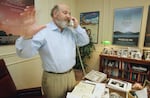 FILE - Rob Reiner talks on the phone at his office at Castle Rock Enterprises, seeking donations for anti-smoking campaigns, July 29, 1988, in Beverly Hills, Calif.
