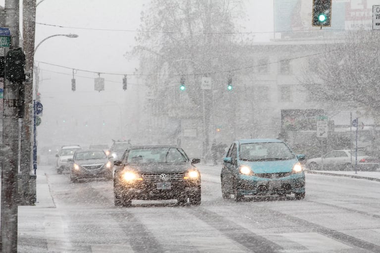 The first snow starts to fall as Portland braces for an unusually strong winter storm, Thursday, Dec. 8, 2016.
